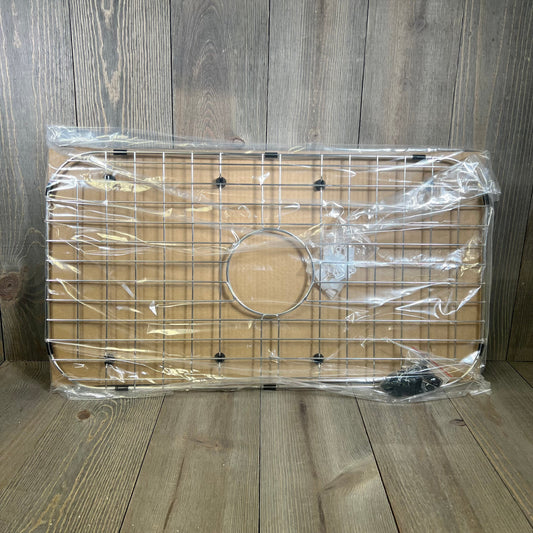 Stainless steel sink protector grid with drain opening, Serene Valley 26-1/16" x 14-1/16", packaged on wooden background.