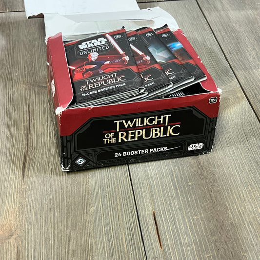 Star Wars Unlimited TCG Twilight of The Republic Booster Display with 24 packs on a wooden table.
