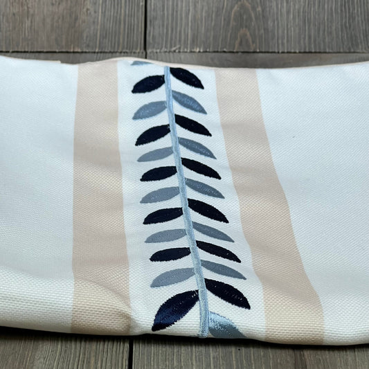 Coastal pillow cover with embroidered leaf design, neutral tan and water-repellent fabric, perfect for outdoor decor.