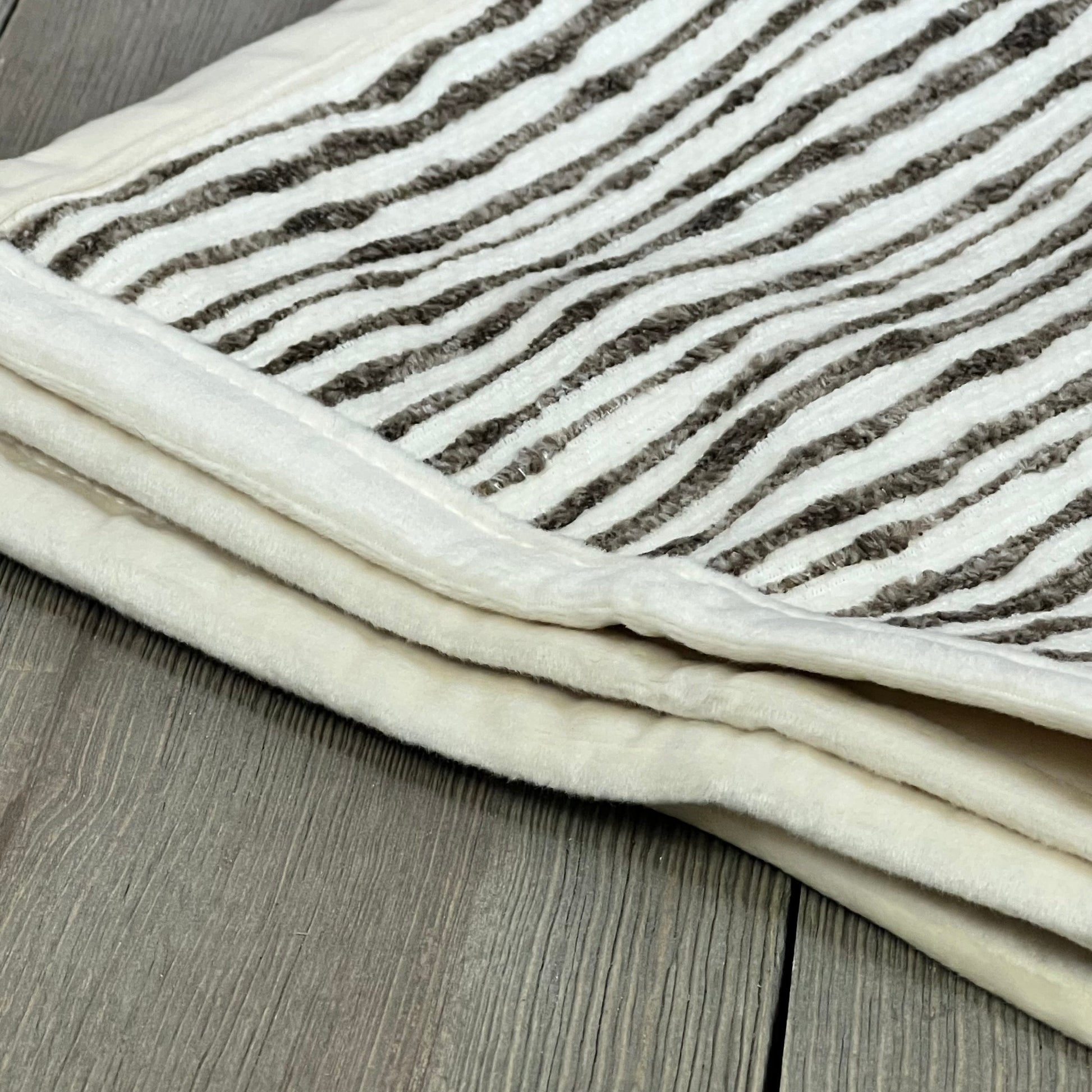 Soft chenille striped brown pillow cover on wooden surface, ideal for couch or bed decor, 18x18 inches.
