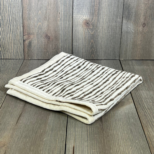 Dark brown chenille striped pillow cover folded on wooden surface, ideal for couch, chair, or bed decor, 18x18 inches.