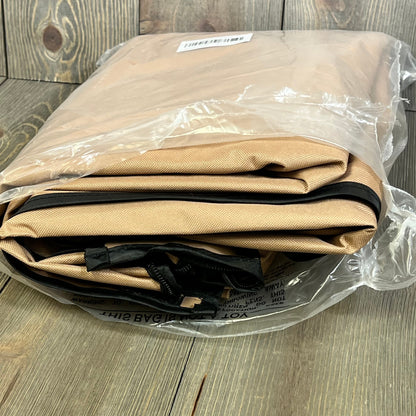 Folded ULTCOVER waterproof outdoor TV cover in protective plastic packaging, ideal for 50-54 inch flat screens.