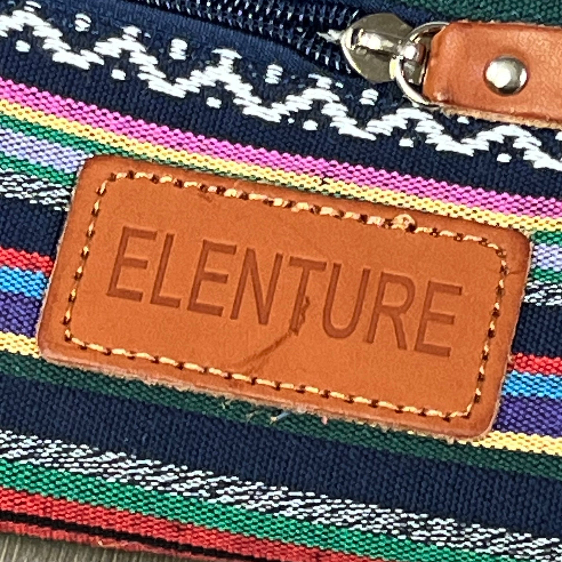 ELENTURE yoga mat bag with colorful stripes and leather logo patch, showcasing durable canvas material and stylish design.