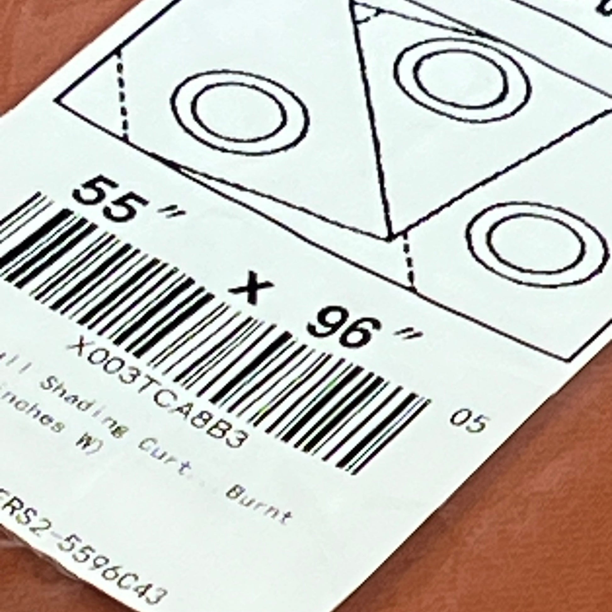 Curtain label for NICETOWN blackout curtains, 55x96 inches, burnt orange, super heavy-duty fabric for bedroom privacy.