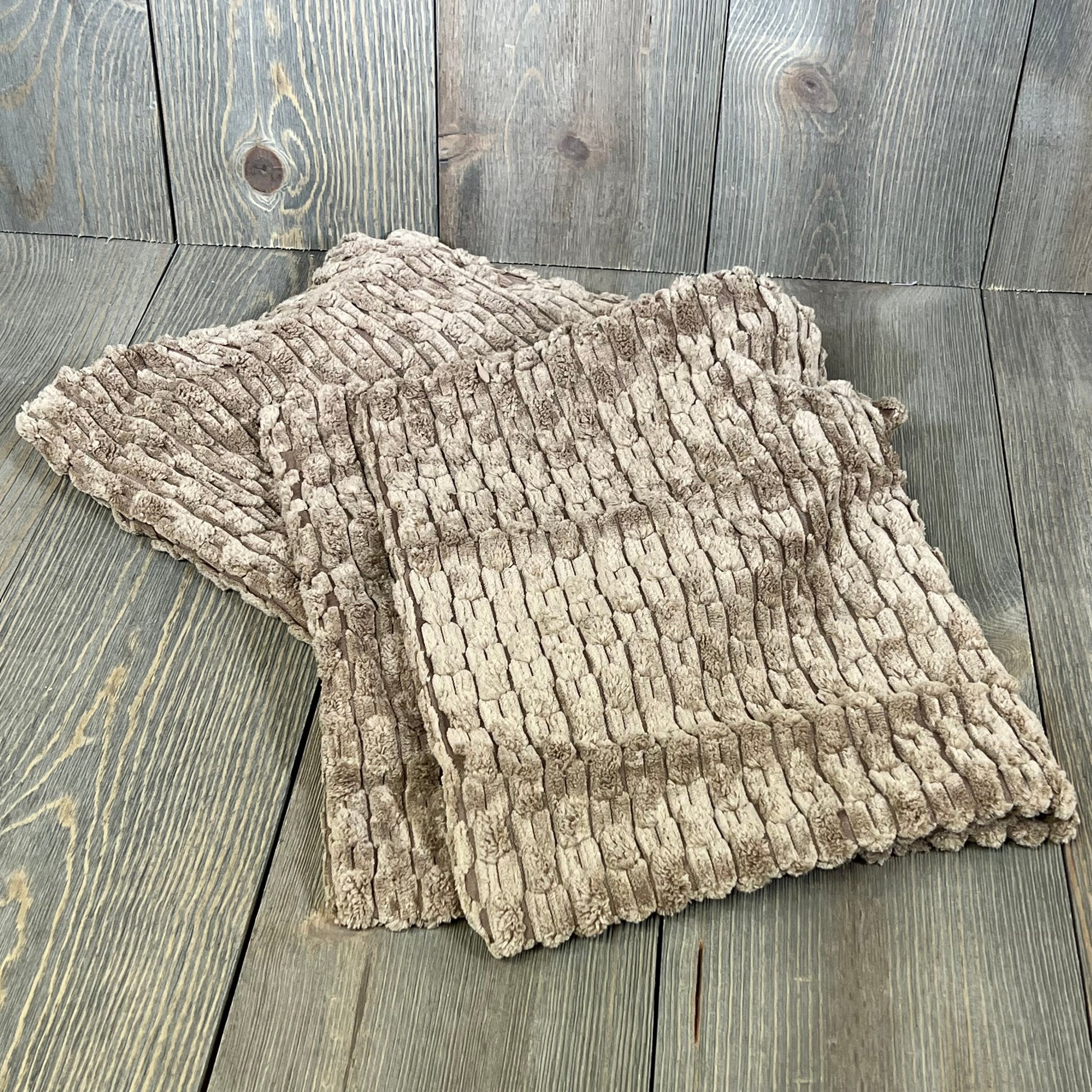 Light brown corduroy lumbar pillow covers on rustic wooden floor, ideal for farmhouse and boho decor, 12x20 inch.