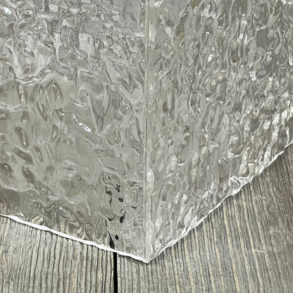 Clear acrylic tissue holder with modern ripple texture, showcasing a stylish transparent design for bathroom decor.