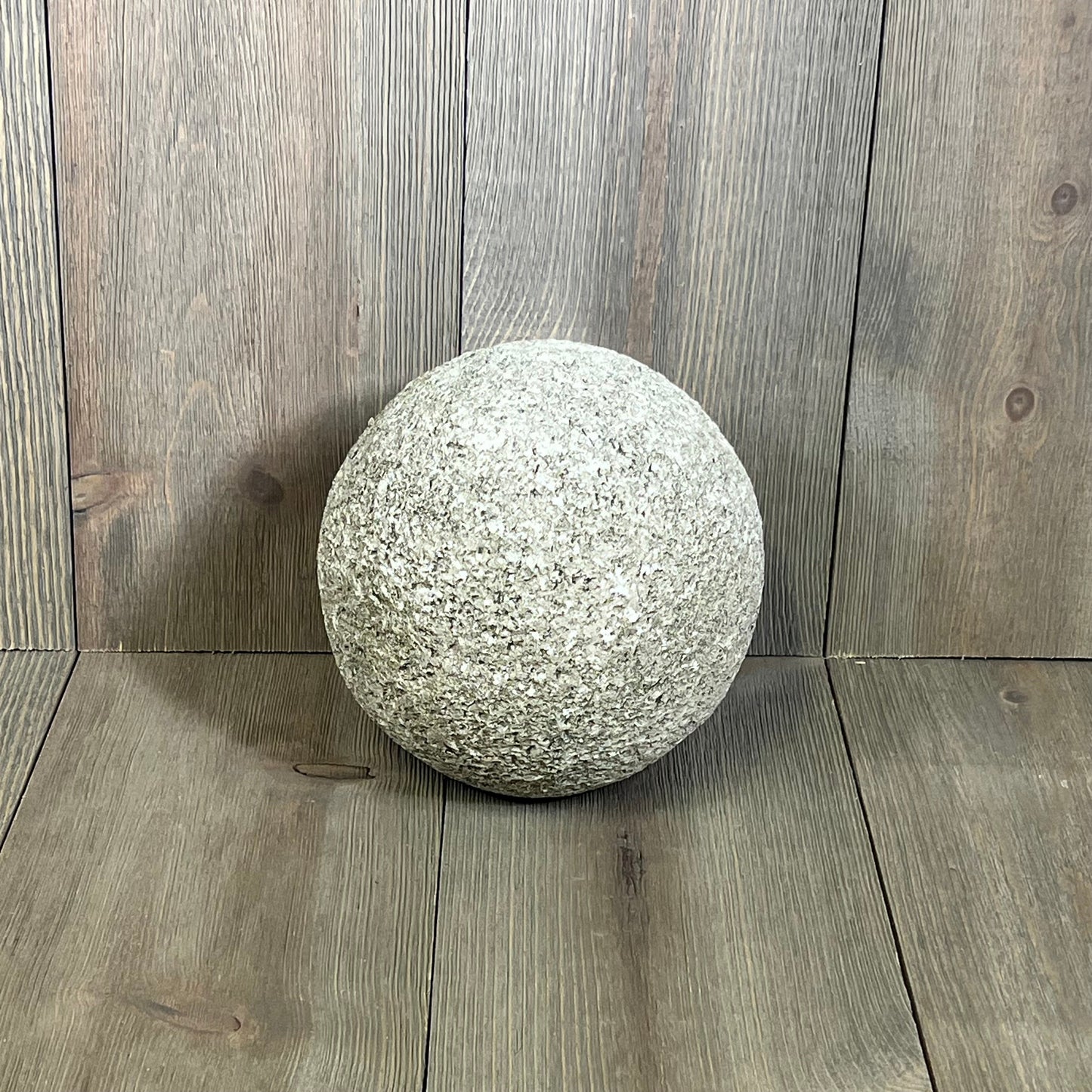 Modern gray polyresin sculpture by Ashley Chanlow, 6-inch sphere design on wood background, adds elegance to decor.
