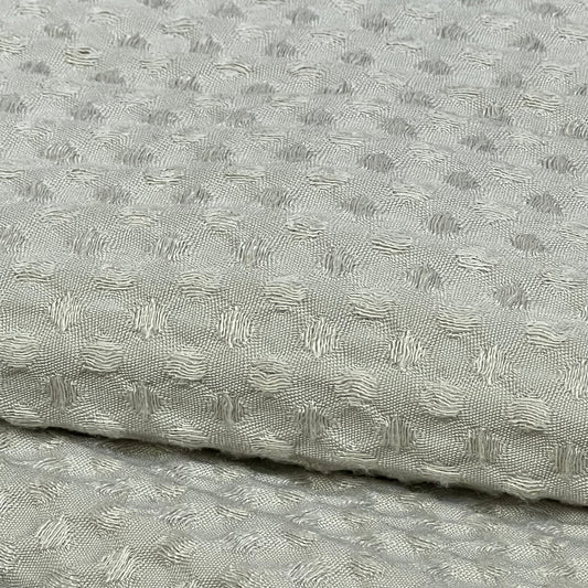 Ultra soft waffle weave pillow shams in light khaki, showcasing intricate texture and breathable fabric.