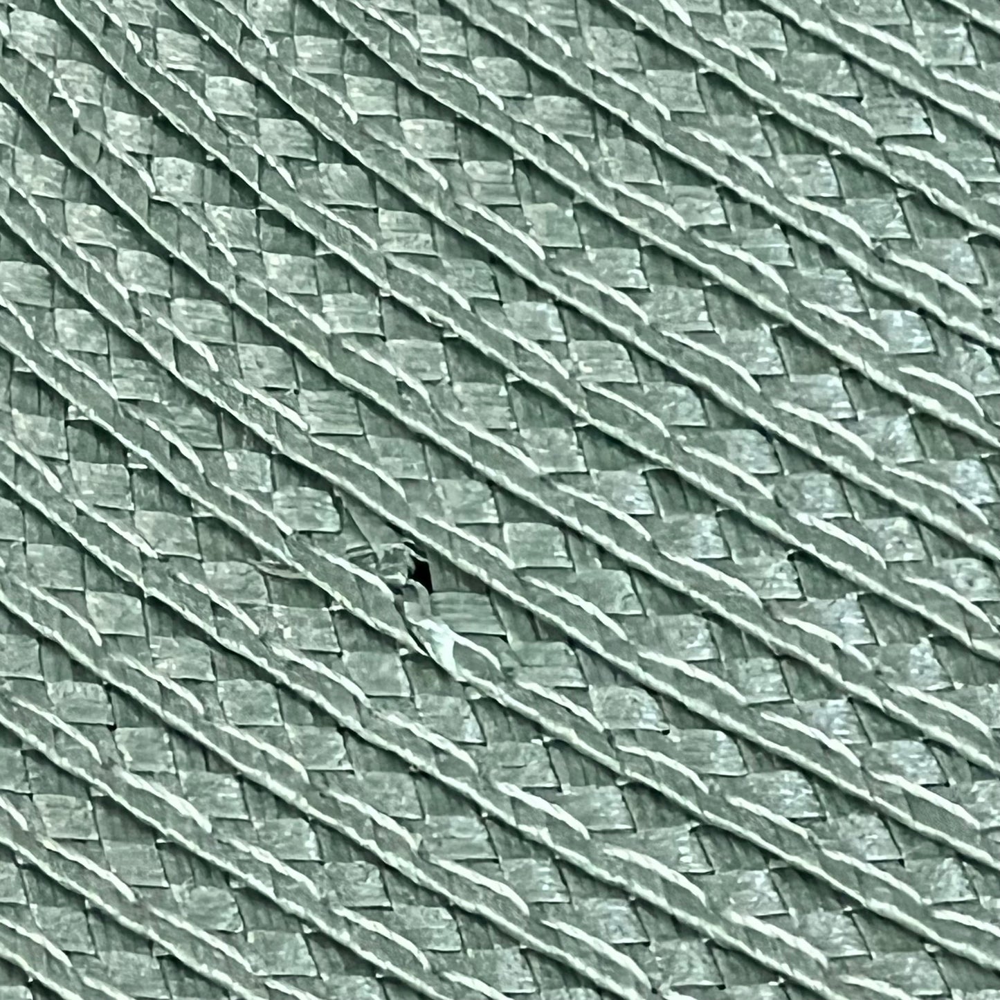 Woven texture of AHHFSMEI sage green placemats, showcasing heat-resistant and non-slip vinyl material for dining tables.