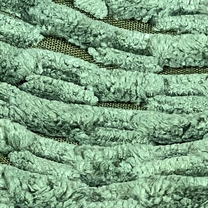 Close-up of moss green corduroy texture on Kevin Textile throw pillow cover, featuring boho stripes for home decor.