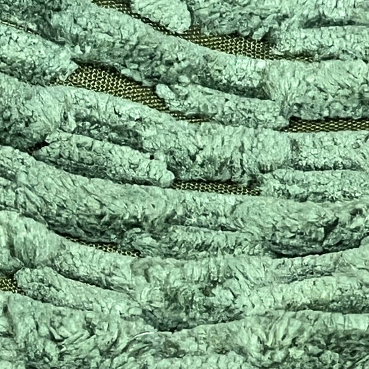 Close-up of moss green corduroy texture on Kevin Textile throw pillow cover, featuring boho stripes for home decor.