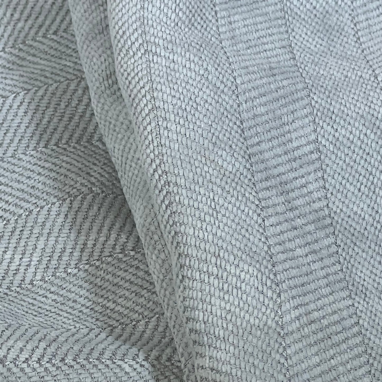 Close-up of light grey chenille fabric texture on MIULEE decorative pillow cover, 24x24 inch, showcasing intricate weave.