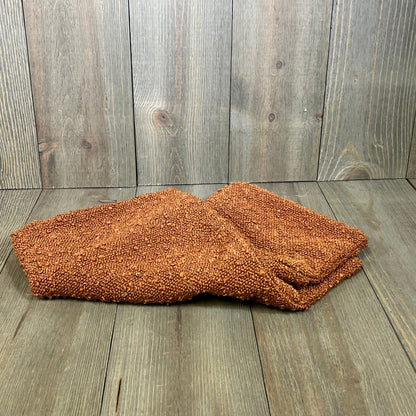 Rust-colored boucle throw pillow cover, 18x18 inches, soft and cozy texture, perfect for modern home decor.