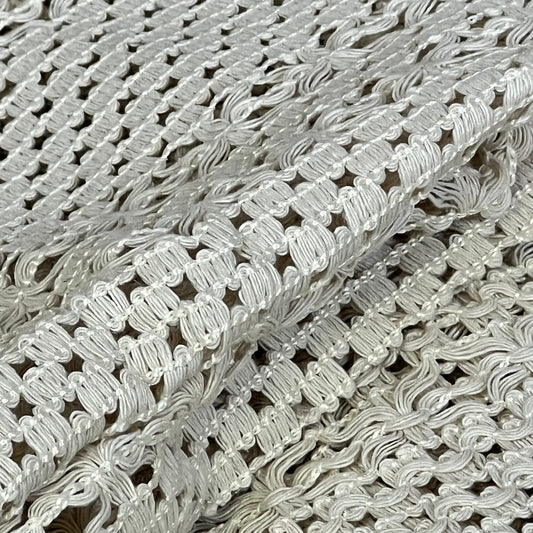 Cream beige macrame table mat close-up, showcasing intricate cotton linen weave and tassel details for farmhouse decor.