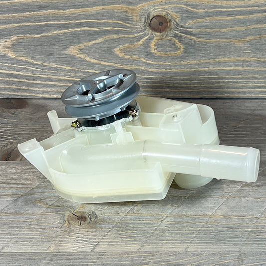 Top load washer drain pump and pulley replacement, showcasing durable plastic design on wood background.