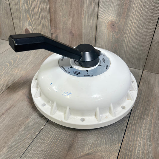 Top Valve Assembly for 2-Inch HiFlow Pool Filter with diverter seal and compression spring on wooden background.