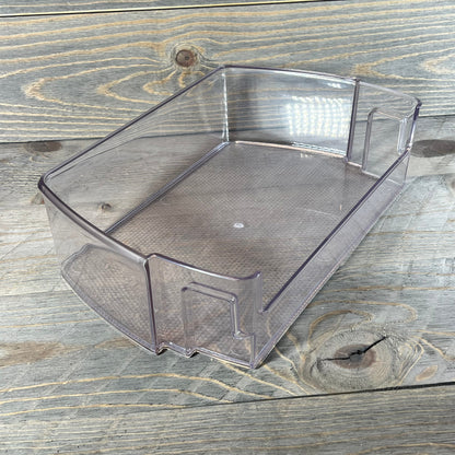 Transparent refrigerator door shelf bin for LG and Kenmore models on wooden surface, part number MAN63948502.