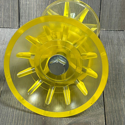 Yellow SeaSense Super Polymer Bow Roller, 4-inch, displaying durable polymer construction against a wooden background.