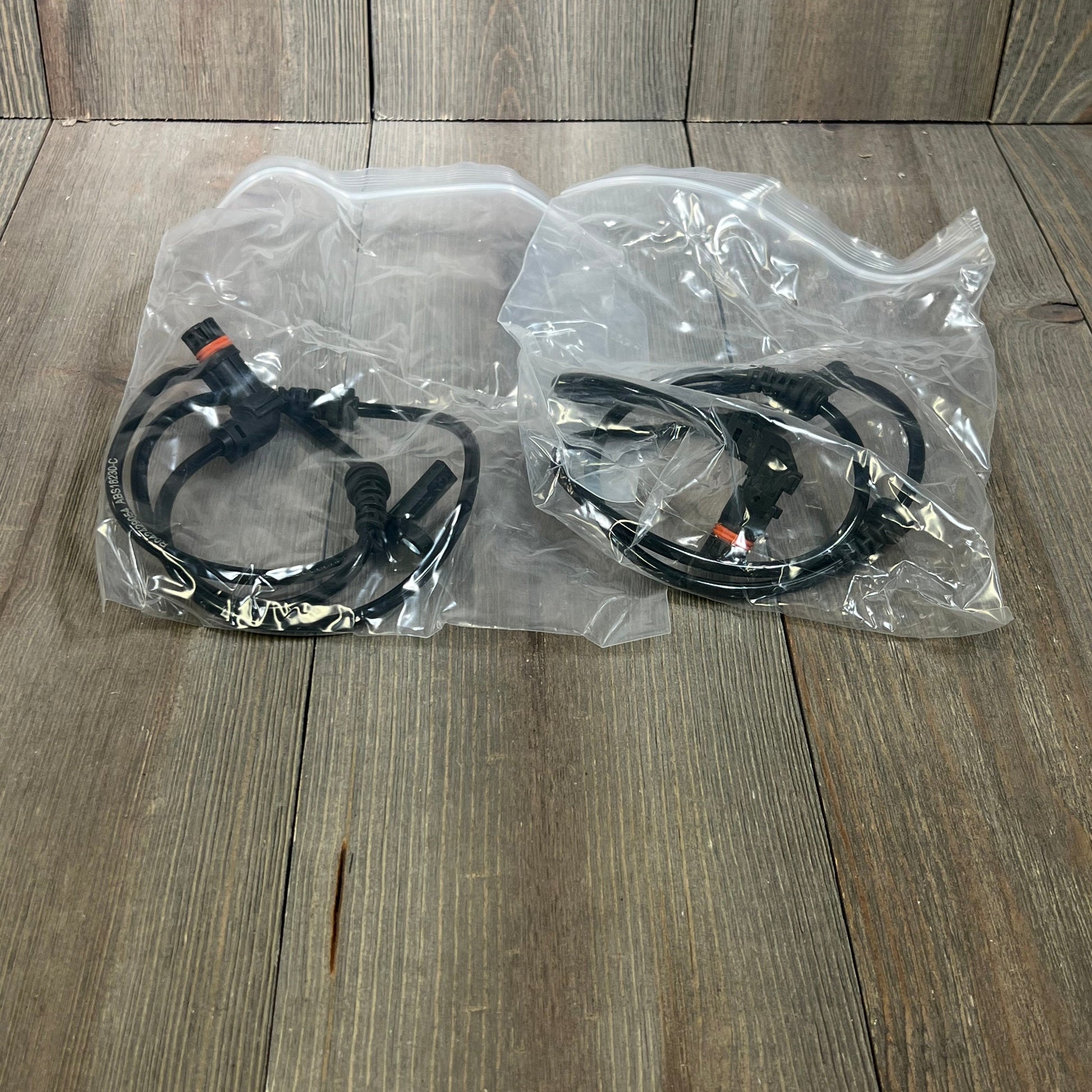 Premium ABS Wheel Speed Sensor set for Mercedes-Benz C300 and GLK350, packaged in clear plastic bags.