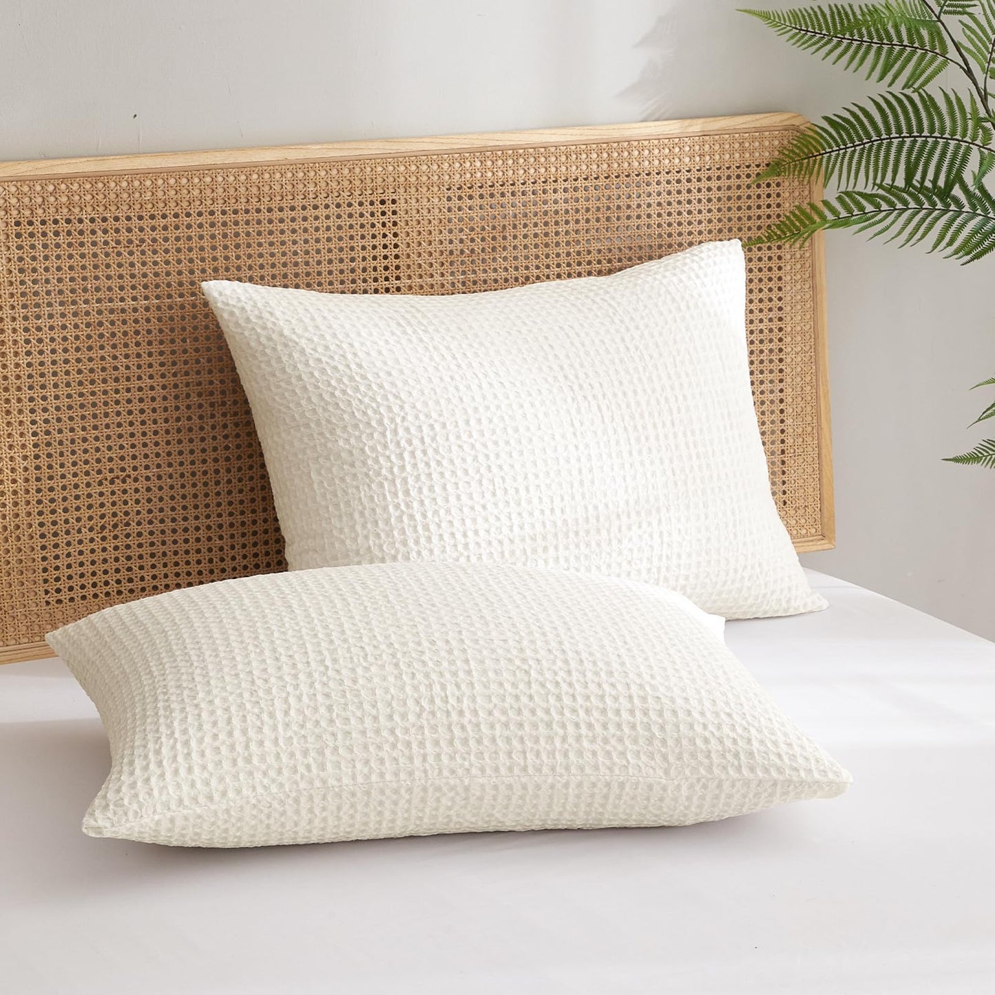 Ultra soft waffle weave pillow shams in coconut white, set of two, adding style and comfort to your bed.