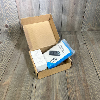 Rechargeable A-1 VMA4400 Batteries and LCD Dual Charger in open box, ideal for Arlo Pro cameras, indoor and outdoor use.