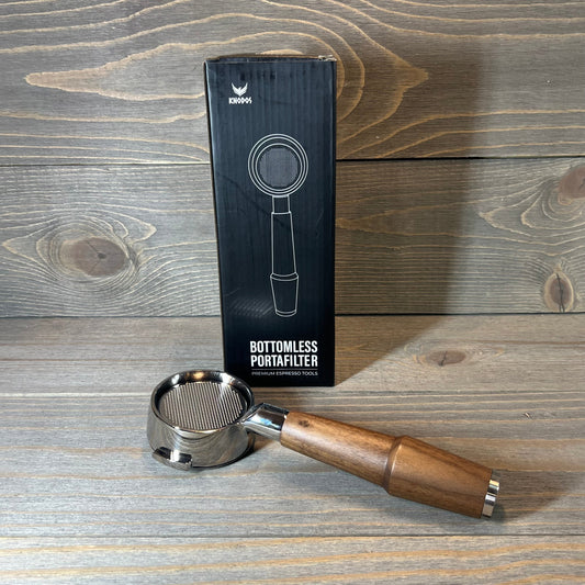 Walnut handle 58mm bottomless portafilter with E61 group head compatibility, shown with packaging on wooden surface.