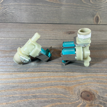 Washer cold and hot side water valve set replacement on a wooden surface, showing connectors and inlets.