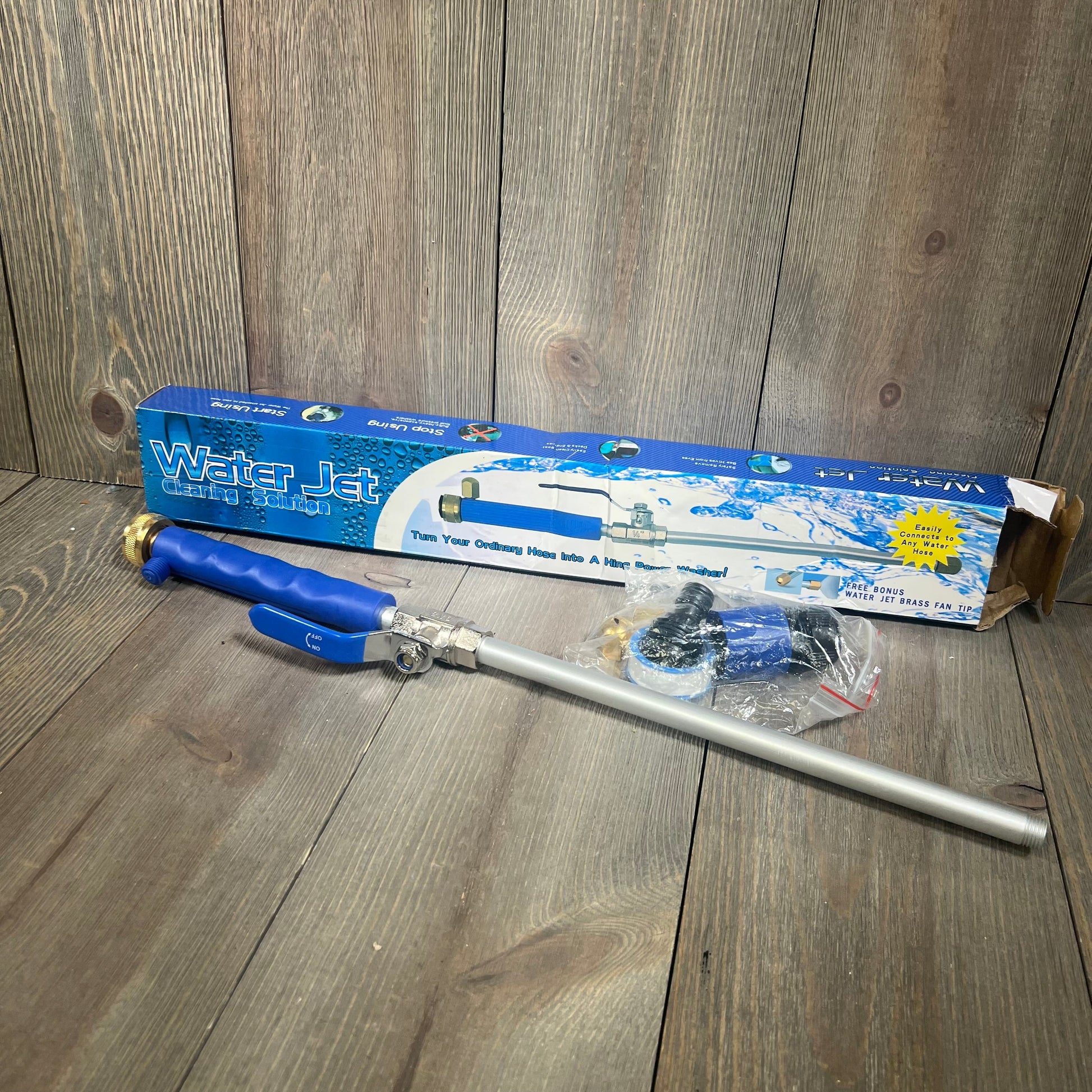 Water Jet cleaning solution with Rerennco nozzles and hose quick connectors on wooden surface.
