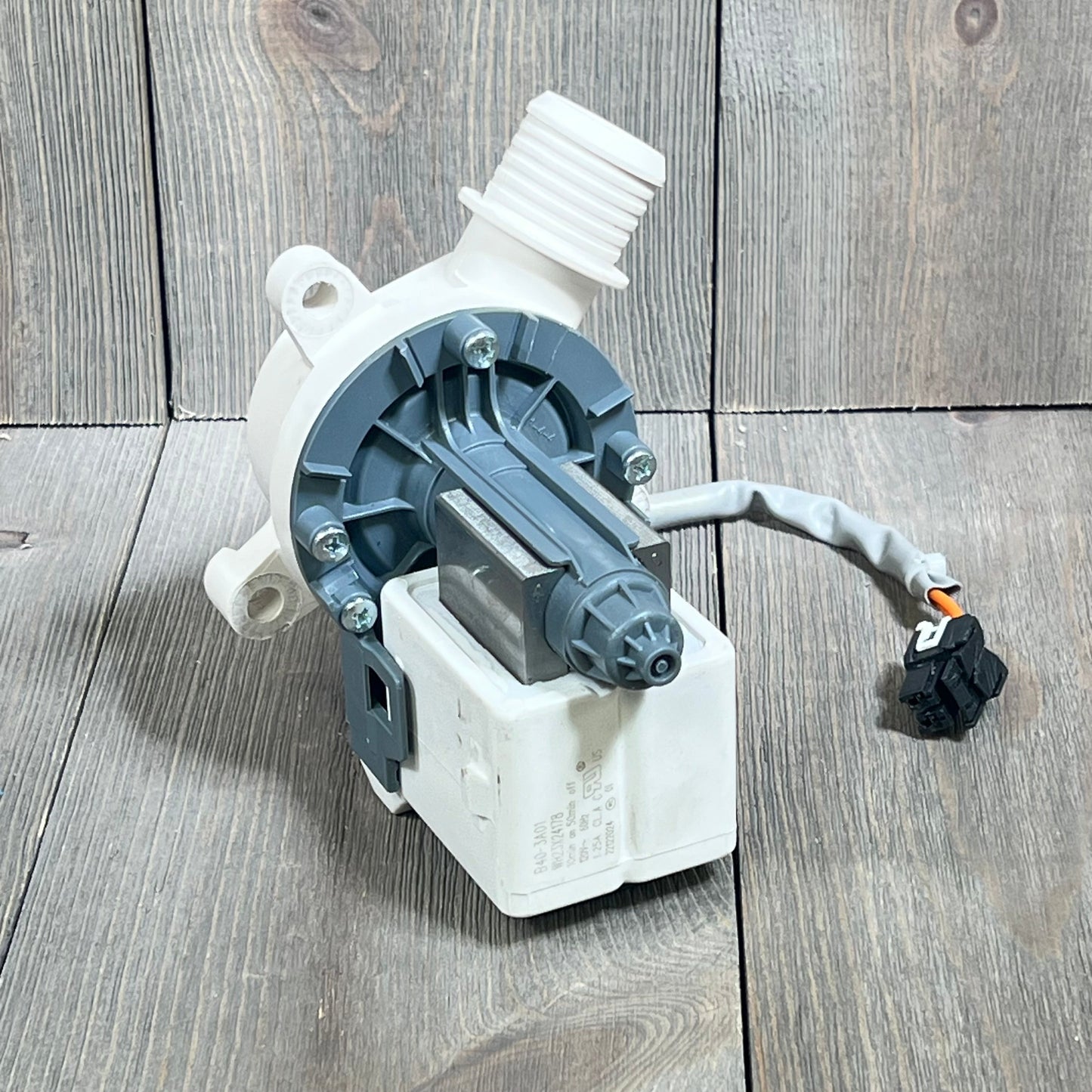 High-quality image of Yendse WH23X28418 drain pump motor for Hotpoint GE washer, showcasing durable design and connections.
