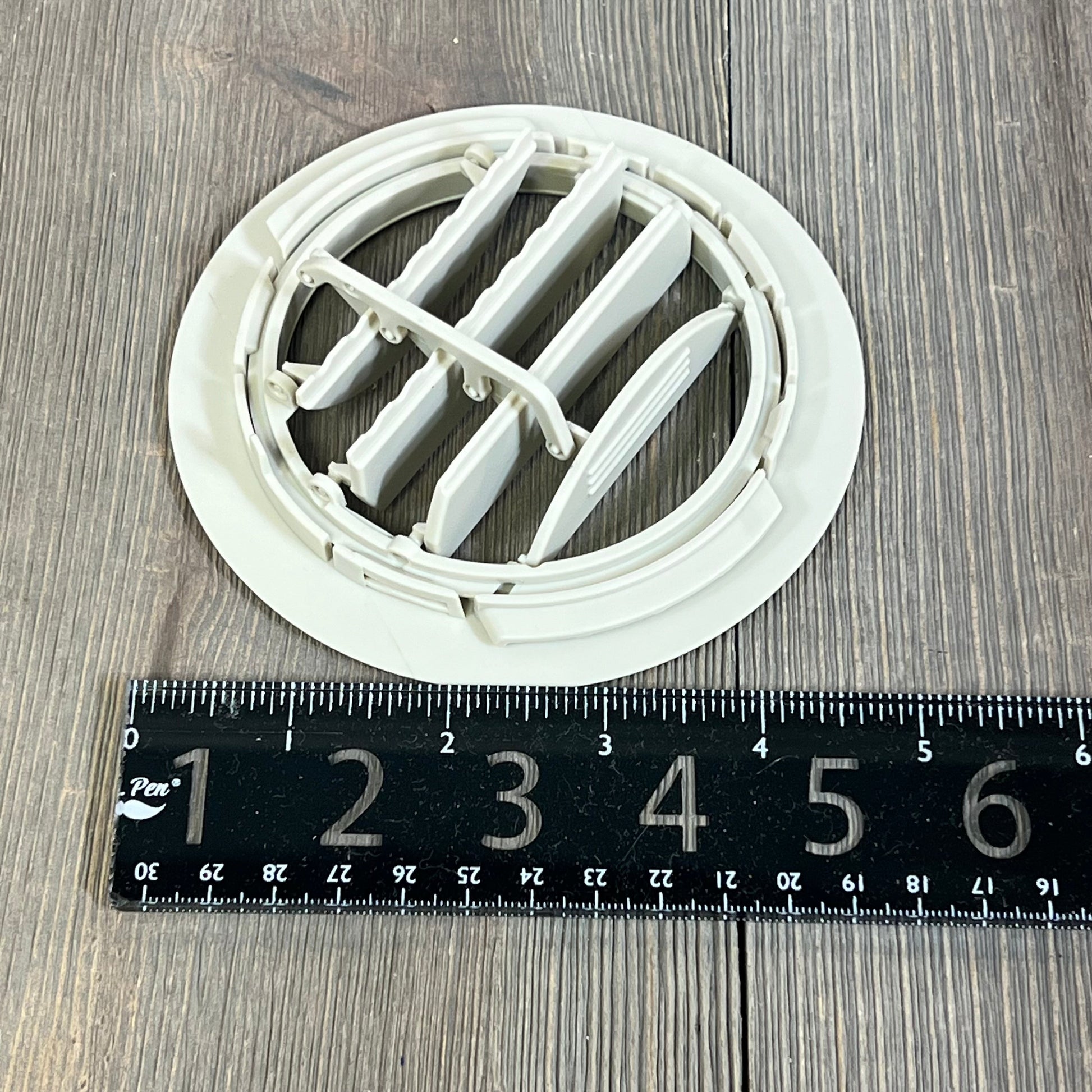 White AC air vent louver for Ford Explorer 2011-2019 and Lincoln MKT 2013-2019, shown with a measuring ruler.