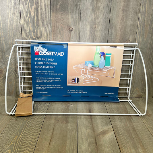 White ClosetMaid 8279 laundry shelf, 24-inch wide, with reversible design, ideal for organizing utilities.