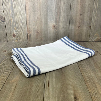 White cotton table runner with blue striped edges, 72 inches long, perfect for spring and summer decor.