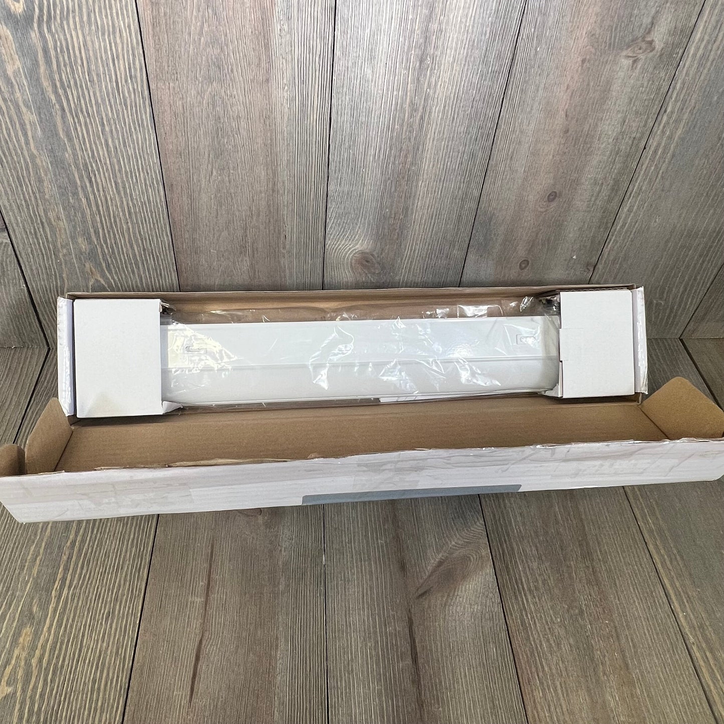 UltraPro 18" under cabinet light in packaging, showcasing dimmable feature with 3 color settings for kitchen use.