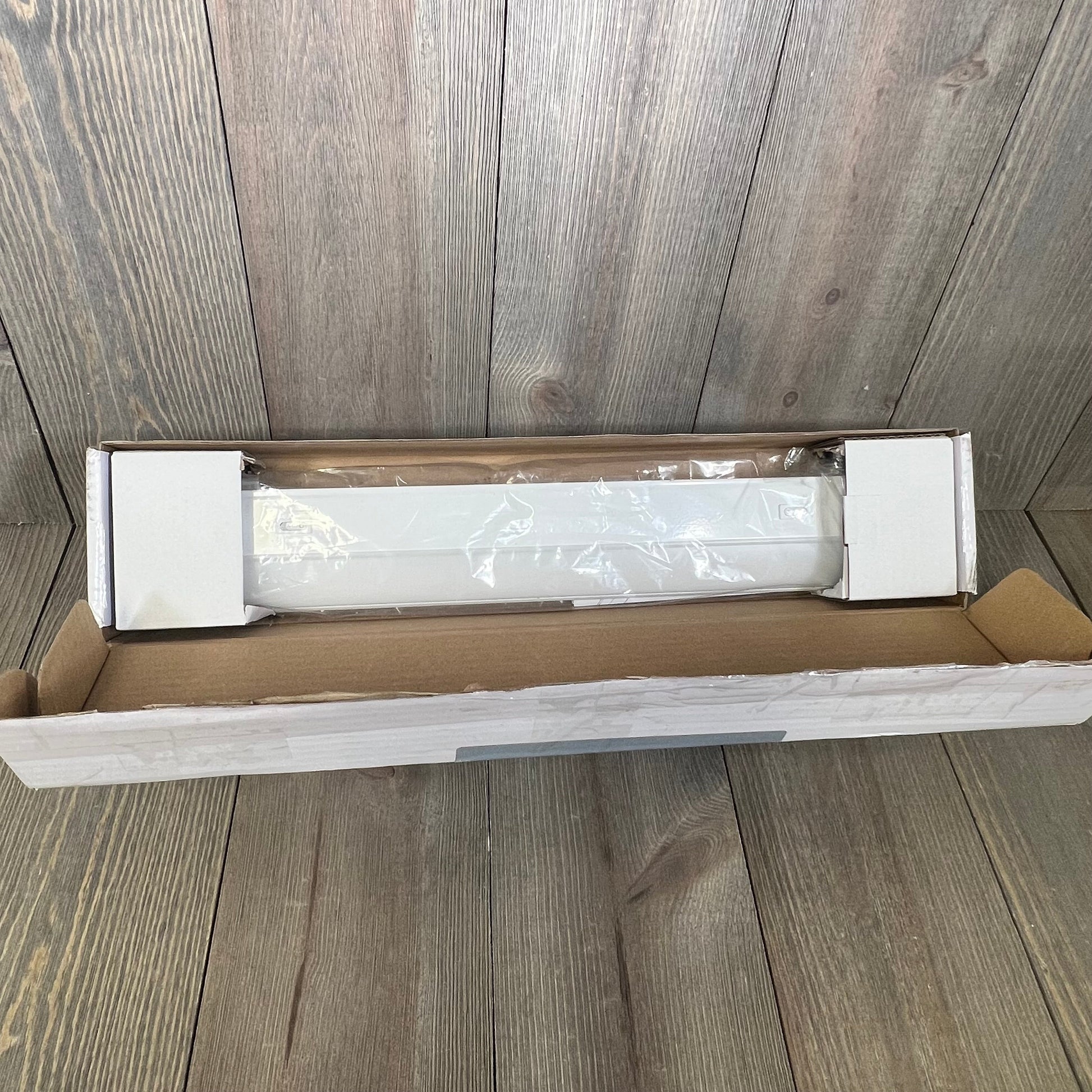 UltraPro 18" under cabinet light in packaging, showcasing dimmable feature with 3 color settings for kitchen use.