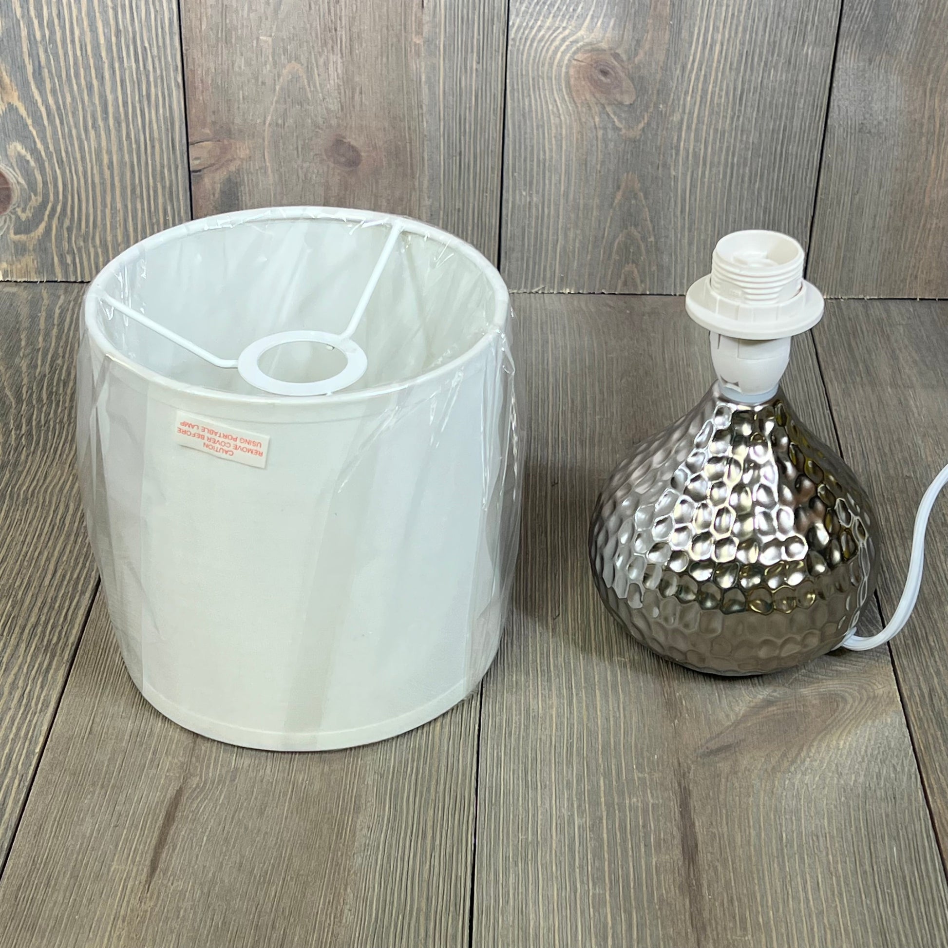 Silver hammered texture base and white shade of Simple Designs LT2073-SVW table lamp displayed separately.