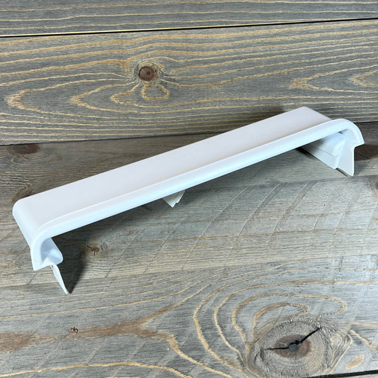 White Frigidaire 241511706 refrigerator door shelf bin on wooden surface, ideal for adding extra storage space.