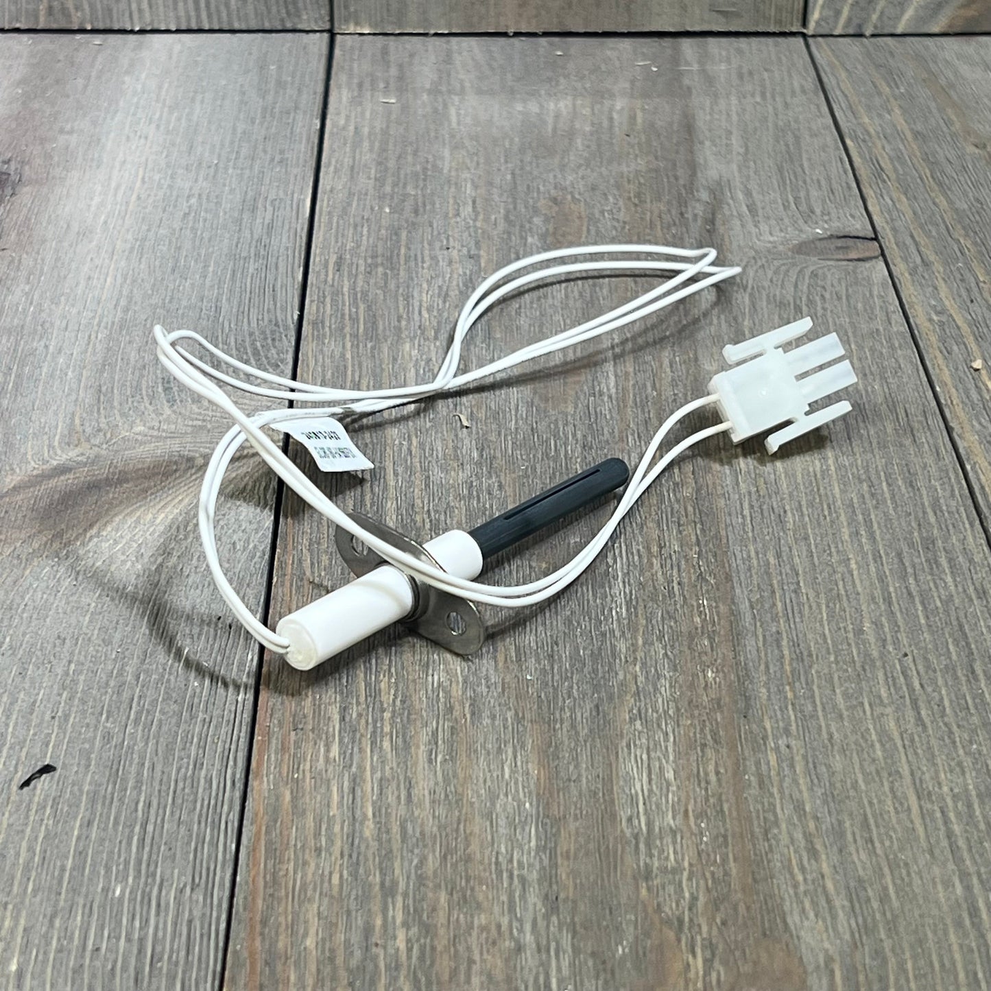 Silicon nitride ignitor kit for Hayward H-Series heaters, featuring a cylindrical igniter head and wiring harness.