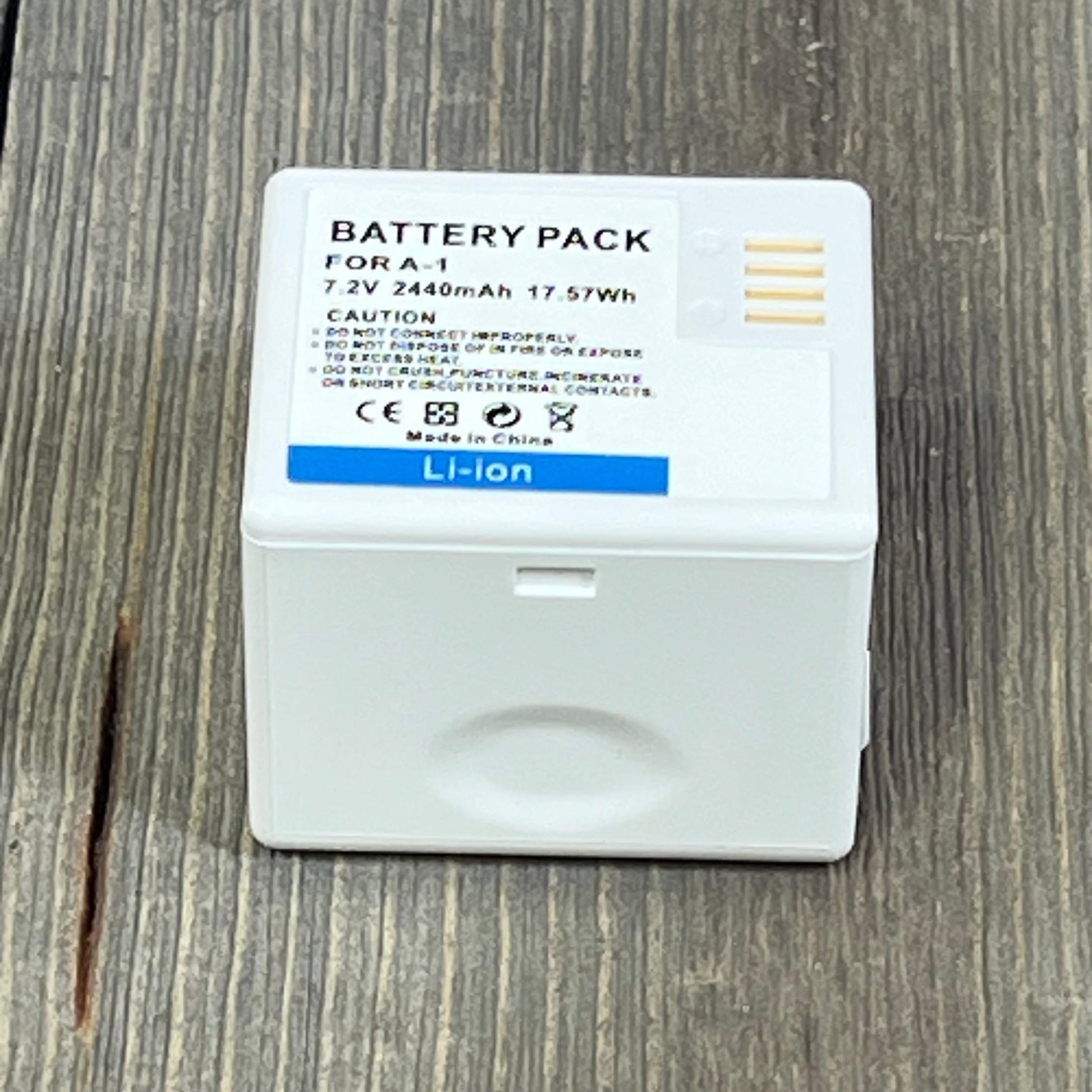 Rechargeable A-1 VMA4400 battery for Arlo Pro, Pro 2, 2440mAh, 7.2V, indoor/outdoor use, shown on wood surface.