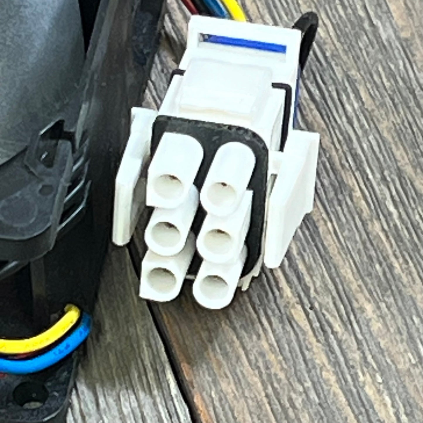 Close-up of the connector on 1046013012-GE Appliances Refrigerator Evaporator Fan Motor WR60X26866, showing wiring details.