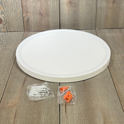 Super slim 12-inch Brightever LED ceiling light fixture with installation accessories on wooden surface.