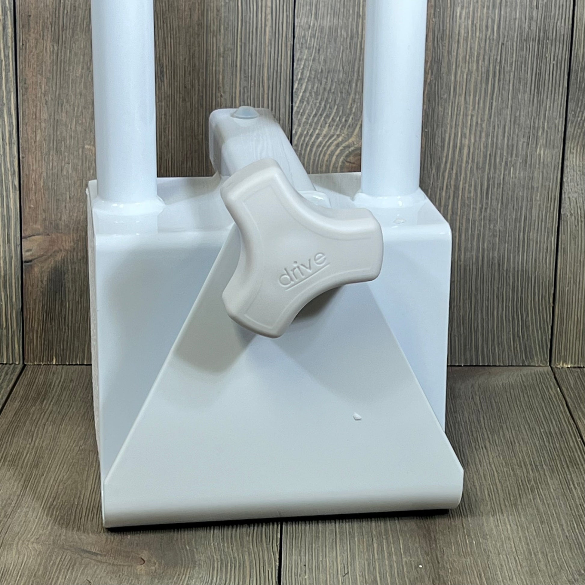 Close-up of Drive Medical adjustable bathtub grab bar with sturdy clamp, ideal for safe bathroom accessibility.