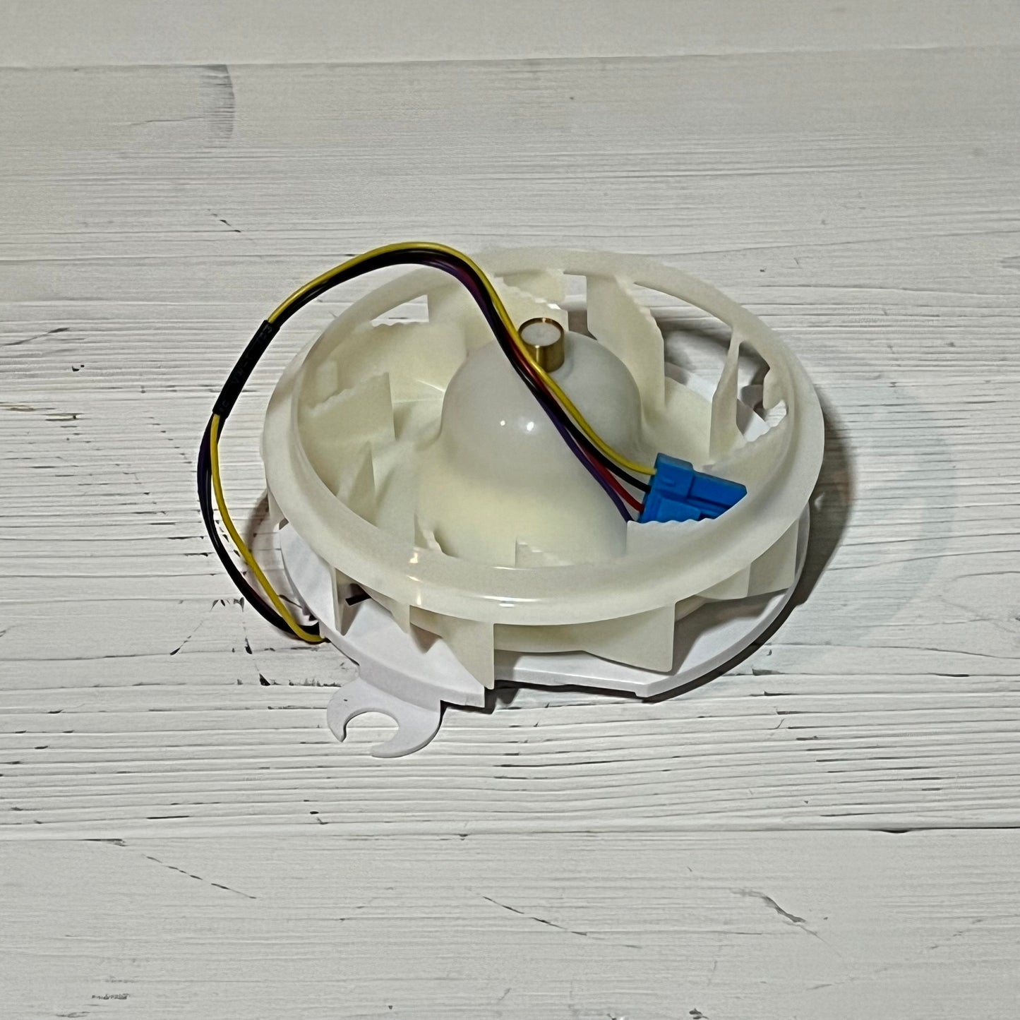 Refrigerator evaporator fan motor assembly for LG, featuring wiring and connectors, enhances freezer cooling efficiency.