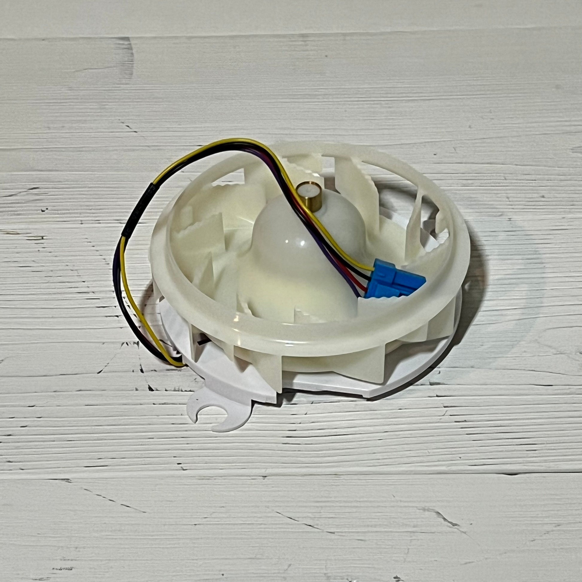 Refrigerator evaporator fan motor assembly for LG, featuring wiring and connectors, enhances freezer cooling efficiency.