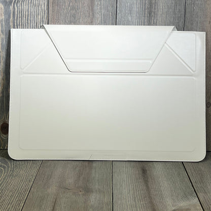 Ultra-slim MOFT laptop sleeve in beach white, designed for MacBook, featuring expandable storage and adjustable stands.
