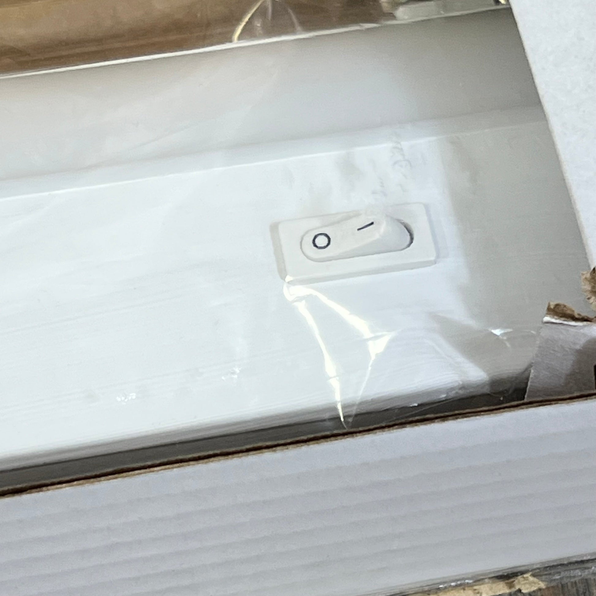Close-up of UltraPro 18 inch under cabinet light switch, showcasing hardwired design and dimmable feature for kitchens.