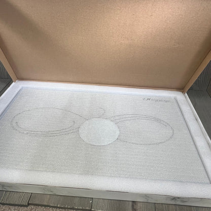 Grey Infinity stone bath mat in packaging, showcasing non-slip, quick-drying diatomaceous earth design for bathroom floors.