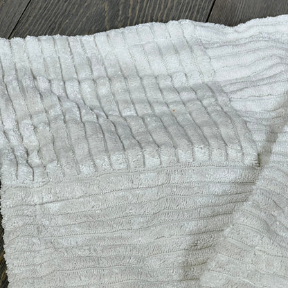Cream decorative throw pillow cover with soft corduroy fabric, featuring elegant cross patchwork design for farmhouse decor.