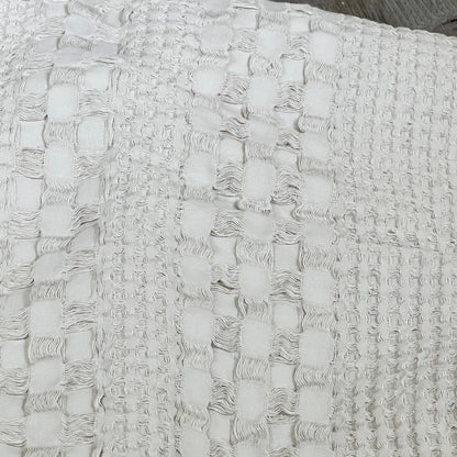 Close-up of oatmeal waffle weave texture on PHF cotton Euro sham cover, highlighting luxurious fabric details.