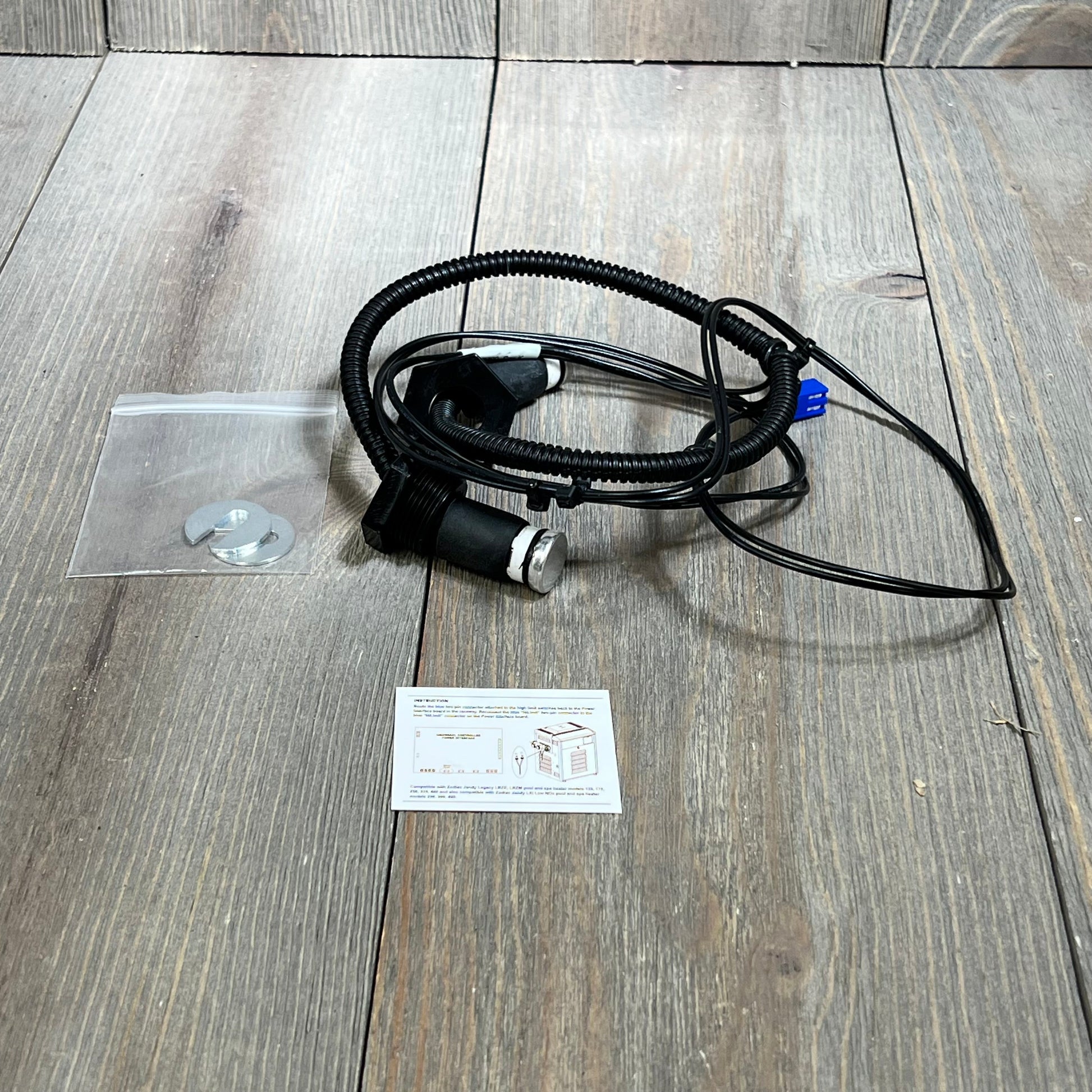 Wire harness assembly for Zodiac Jandy Legacy LRZE heaters, shown with components on a wooden surface.