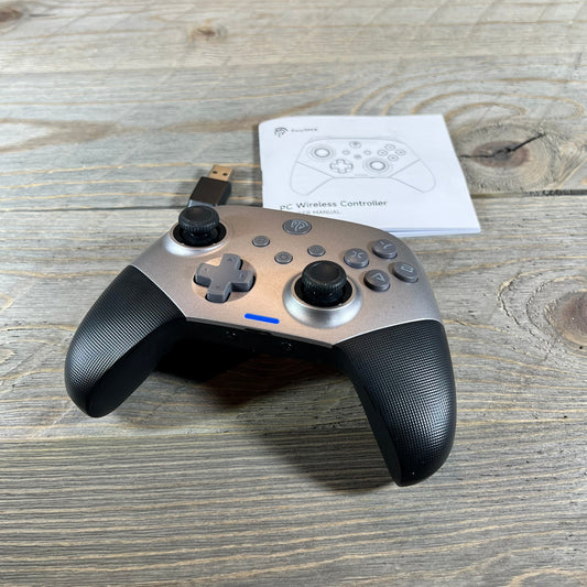 Wireless Bluetooth controller EasySMX X10 with ergonomic design, shown with manual on wooden surface.